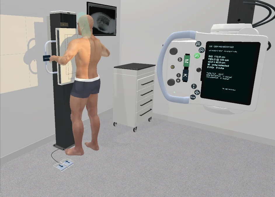 CETSOL virtual patient positioned at the upright bucky beside the radiography equipment.